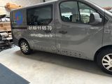 a silver van that is parked in a garage