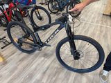 a man standing next to a bicycle in a store