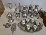 a lot of silver items that are on a table