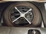 a close up of a car ' s steering wheel with a wren on it