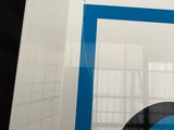 a picture of a blue and white logo on a white box