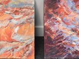 two paintings of different colors are shown on a black surface
