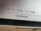 the back of a laptop computer with a sticker on the back of it