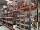 a large rack with many items on it in a warehouse