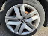 a close up of a tire on a car ' s rim