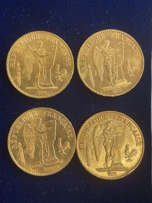 four gold coins with a picture of a man and a woman on them