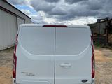 a white van that is parked in a lot