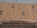many boxes of food sitting on a pallet on the floor