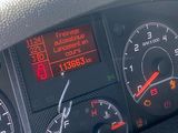 a close up of the dashboard of a car with various gauges and numbers
