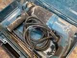 a tool in a case that is sitting on the floor