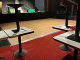 three tables that are sitting on the floor in the room