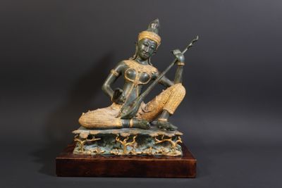 an image of a statue of a woman playing a musical instrument