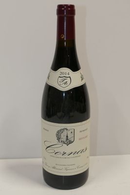 a bottle of wine that is sitting on a table
