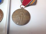 a medal and a medal on display in a case