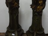 two vases that are sitting on a wooden table