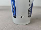 a cup with a picture of a man and a woman on it