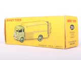 toy truck in yellow box on white surface with white background