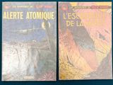 two books that are sitting on a blue table