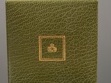 an image of a green box with a gold logo on it