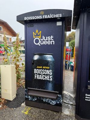 a black trash can that is next to a black trash can