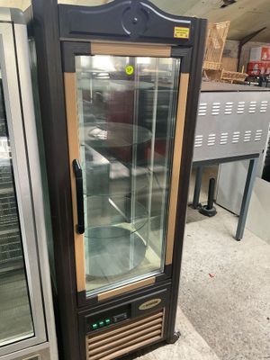 an image of a refrigerator with a glass door in a store