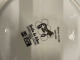 a white plate with a black and white design on it