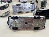 a lot of toy cars that are on a table