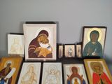 a lot of framed religious art on a table