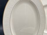 two plates and a bowl are sitting on a table