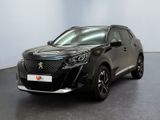 vue de face d'un SUV noir garé dans un showroom