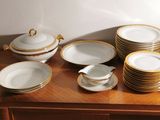 a lot of plates and cups on the table