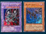 four different cards of different colors and designs on a blue background