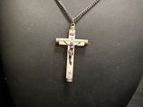 a necklace with a cross on a mannequin mannequin mannequin mannequin mannequin mannequin mannequin mannequin mann