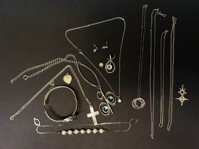 a lot of different necklaces and bracelets on the table