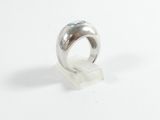 a close up of a silver ring on a white surface