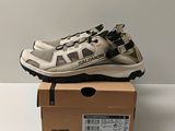 men ' s salidate hiking shoes in a box on a table