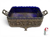 an antique silver and blue glass tray on a white background