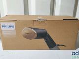 packaging of a philips hair dryer sitting on top of a cardboard box