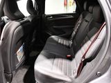 the back seats of a car are black with red trims
