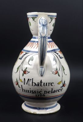 ROUEN. Pichet à cidre en faïence à décor floral polychrome, …