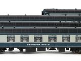 three blue and white train cars sitting next to each other on a white surface