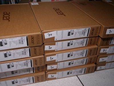 several boxes stacked on top of each other on a tiled floor