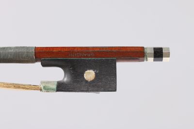 a bow that is attached to a bow with a wooden handle