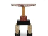 a round marble table with a wooden base and a black base