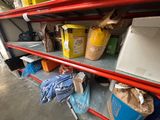 many boxes and bags on the shelves in the garage