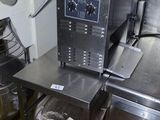 an image of a commercial kitchen with stainless steel appliances