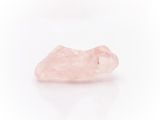 a pink quartz stone on a white background