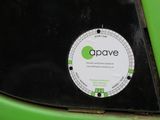 a sticker on the back of a green car