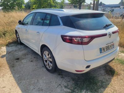 a picture of a white car parked on a dirt road