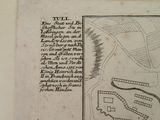 an old map of a town on the side of the road
